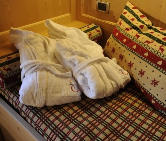 Single bed with bathrobes