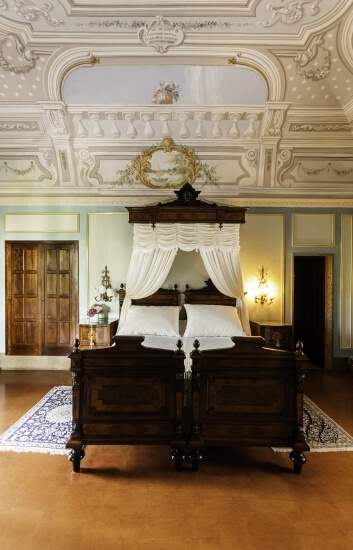period bed with ceiling frescoes