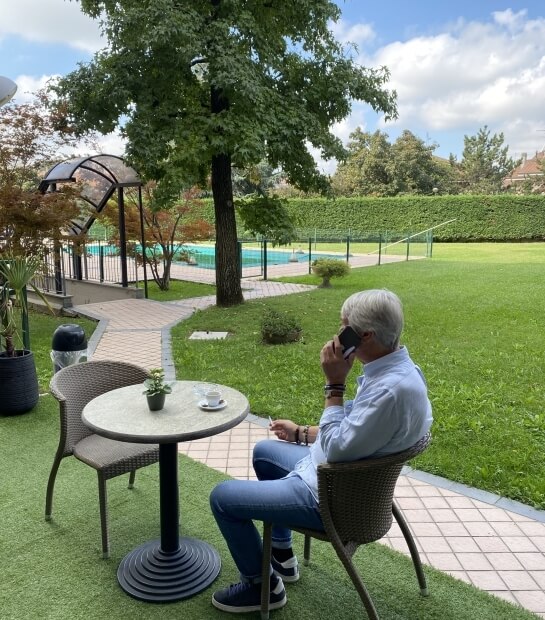 a man on the phone in the garden