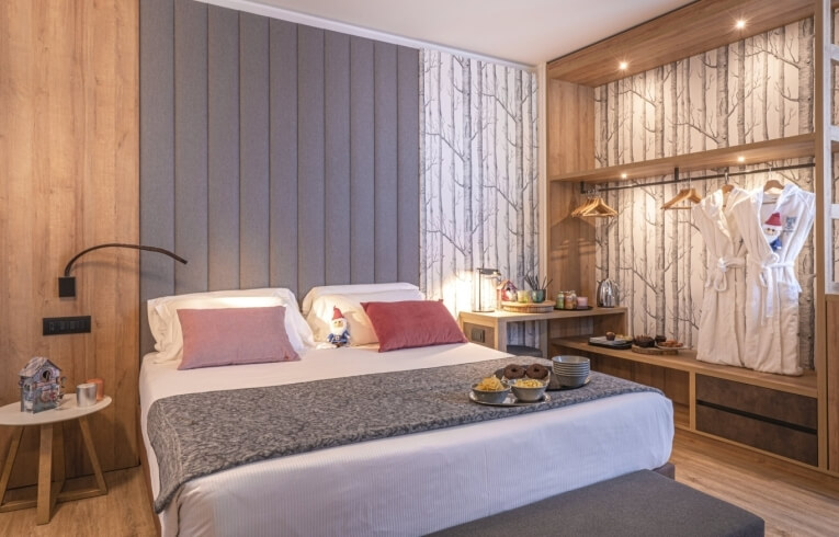 Cozy hotel room with snacks, cookies, and decorative elements.