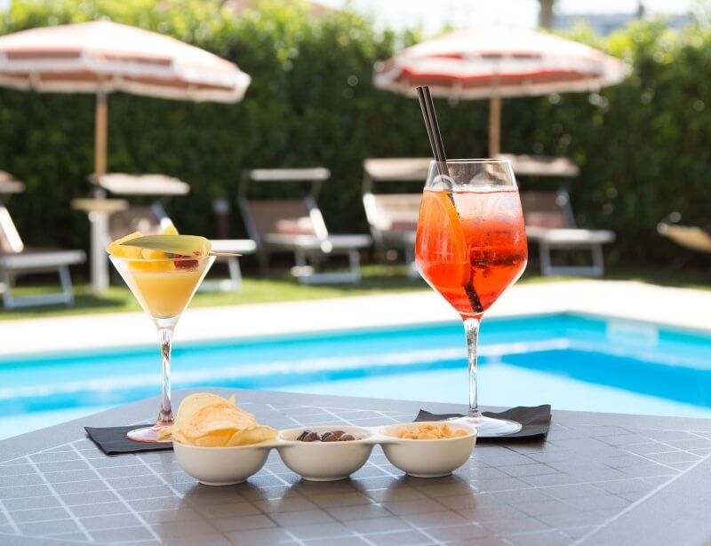 Taste a drink by the pool on Parma