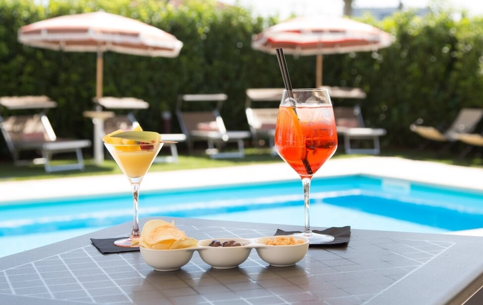 Taste a drink by the pool on Parma