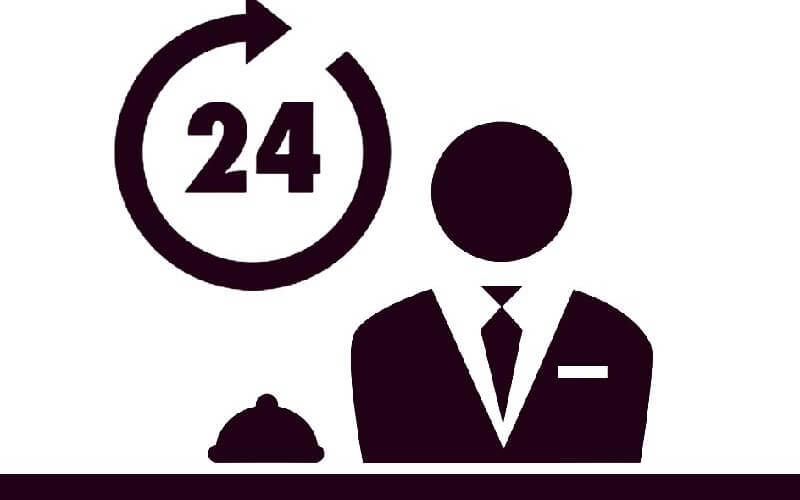 Dark purple silhouette of a suited man at a desk with a bell and a circular arrow indicating 24/7 customer service.