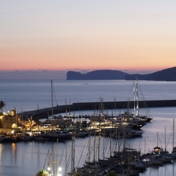 Port of Alghero with Capo Caccia at sunset