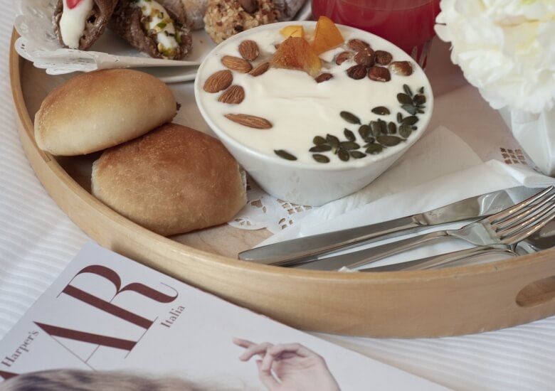 yoghurt and fruit with magazine next to it