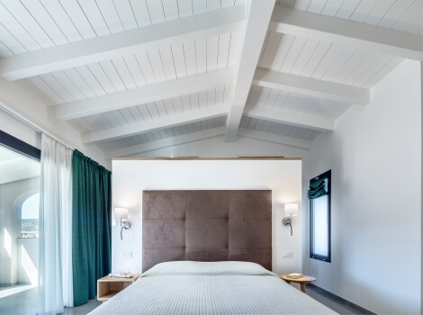 room with white wooden ceiling