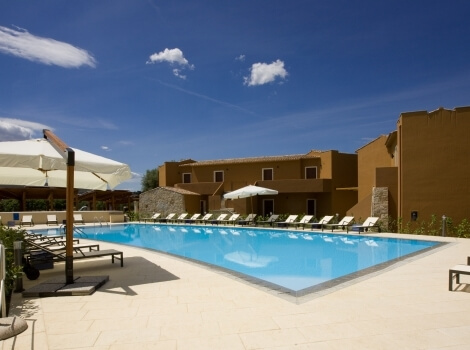 swimming pool with sun loungers 