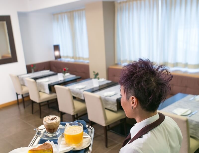 Kindness and courtesy in the breakfast room of the Hotel Touring Carpi
