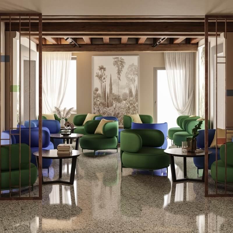 Area lounge con poltrone blu e verdi, tavoli scuri e opere d'arte.