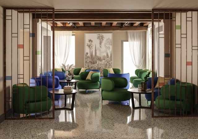 Area lounge con sedute colorate e arte botanica alle pareti.