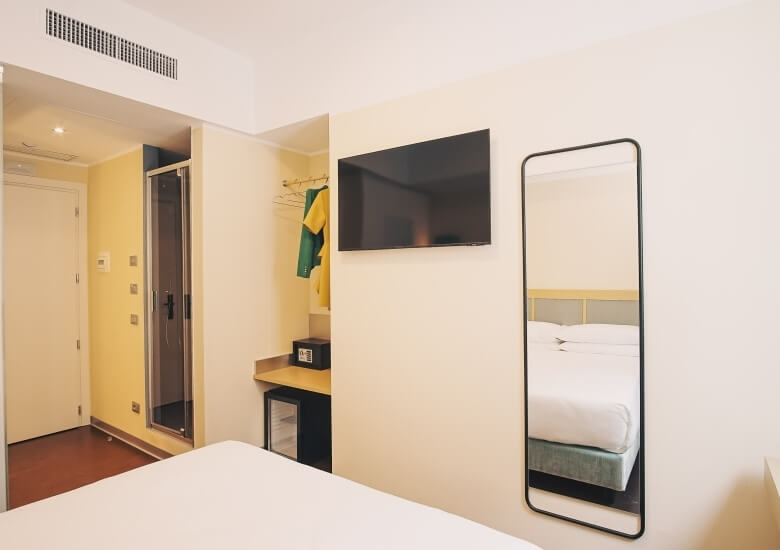 wall with TV and mirror