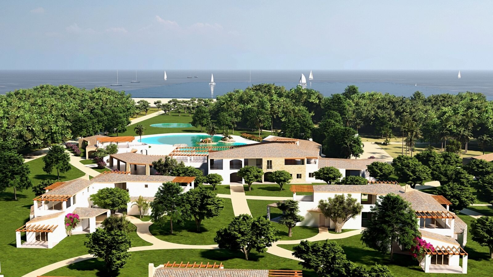 Vista aerea di un resort con piscina e mare sullo sfondo.