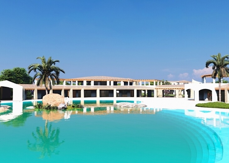 Area comune di un resort con piscina turchese e palme.