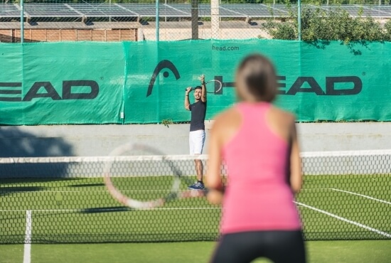 Guests of the resort play tennis