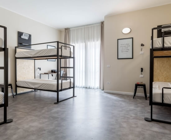 room with six single beds