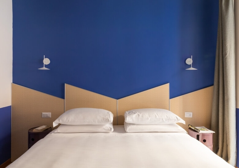 room with blue wall in deluxe flat 