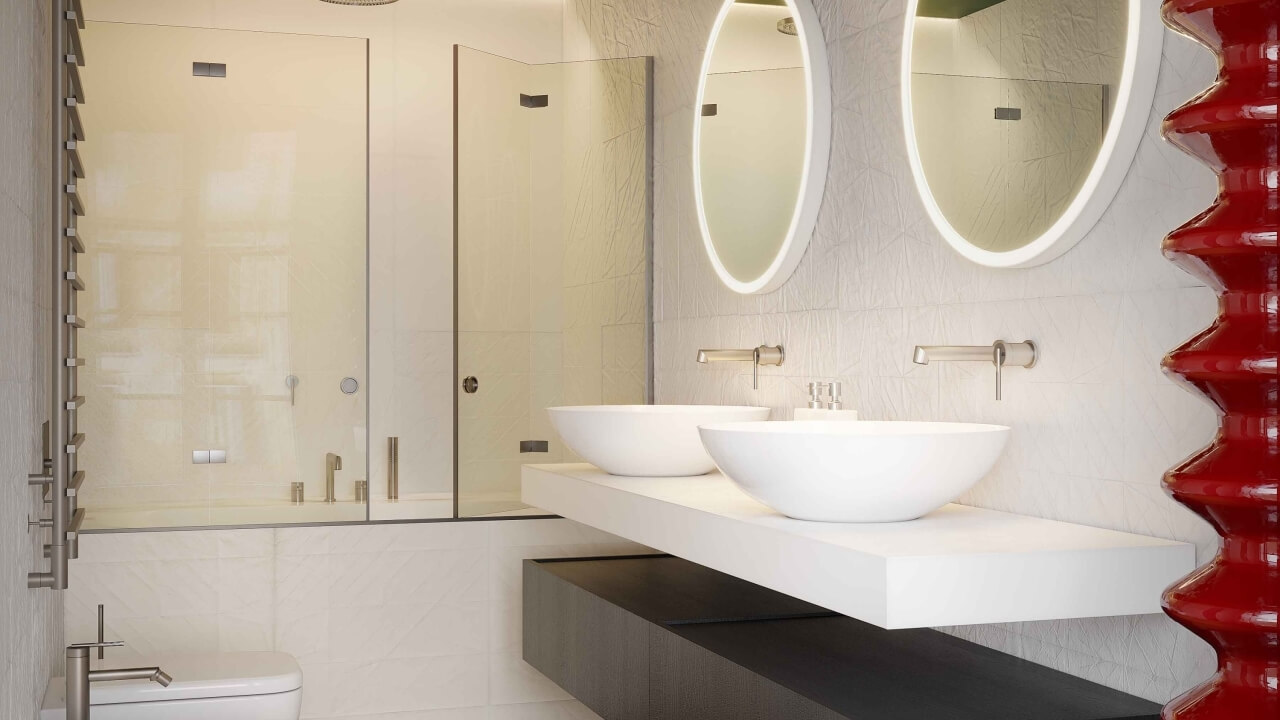 Modern bathroom with a white bathtub, chrome fixtures, red decor, and illuminated mirrors, exuding luxury and sophistication.