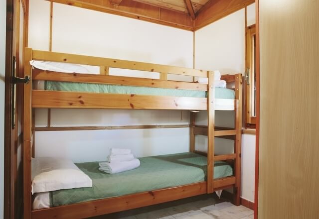 Bedroom with bunk beds in Bungalow Torre del Porticciolo