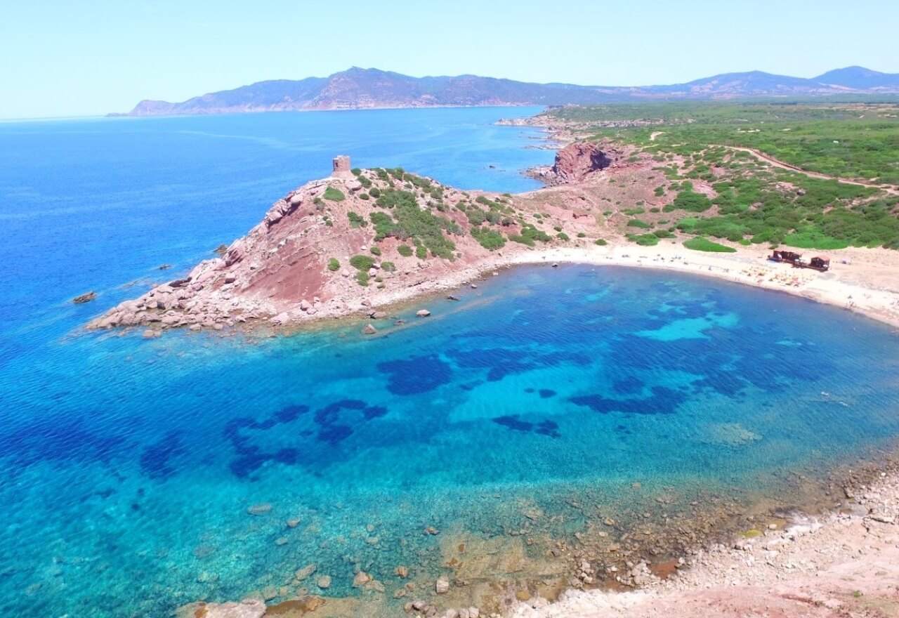 Aerial view of the tower and the beach of Porticciolo