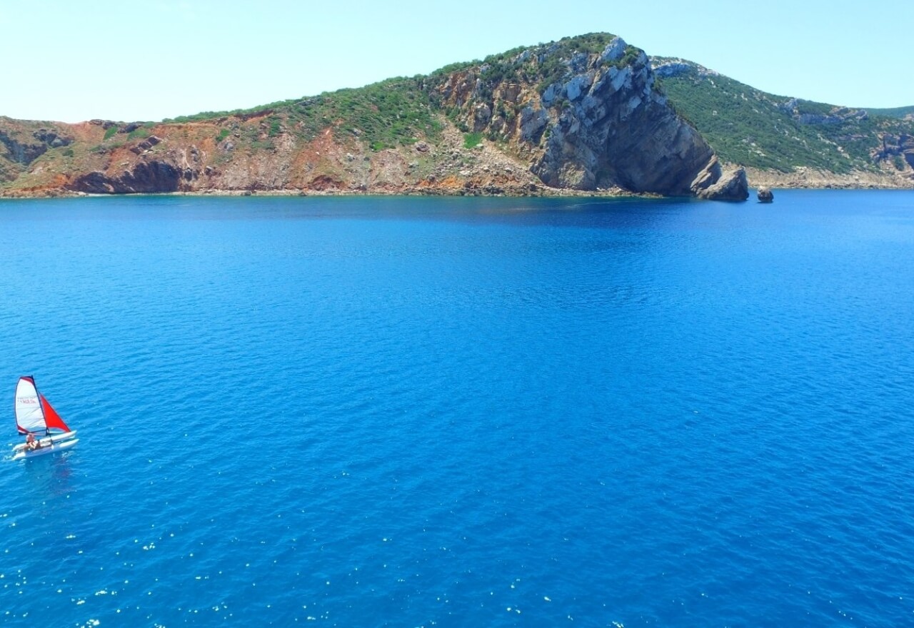 Sailboat in the sea of the Torre del Porticciolo